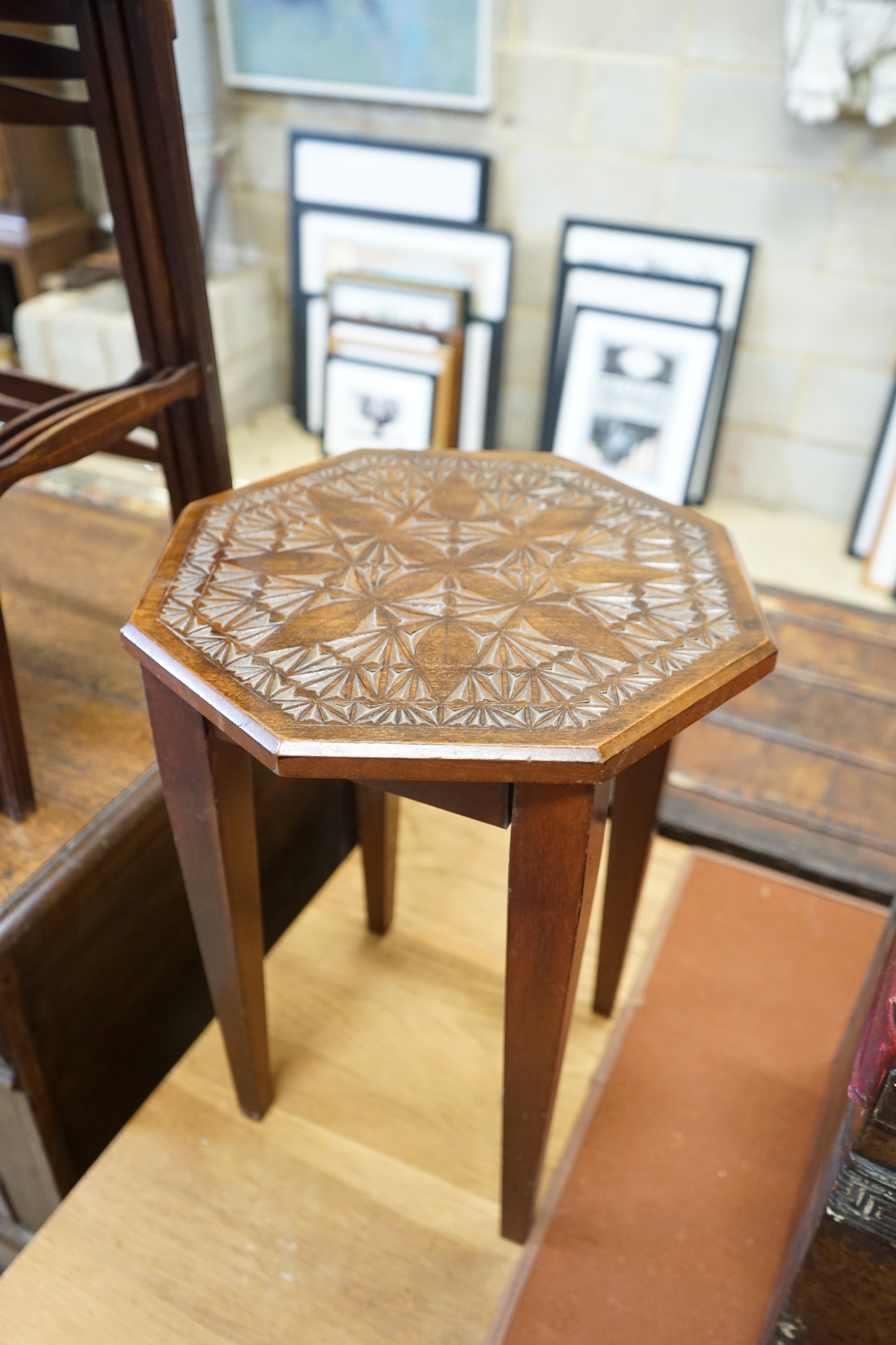A nest of three Edwardian mahogany tea tables, height 61cm, a nest of three oak tea tables and an octagonal carved occasional table